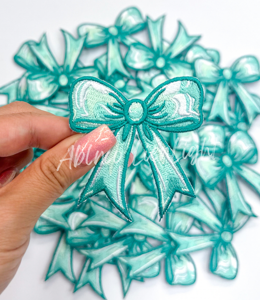 Turquoise bow embroidery patch